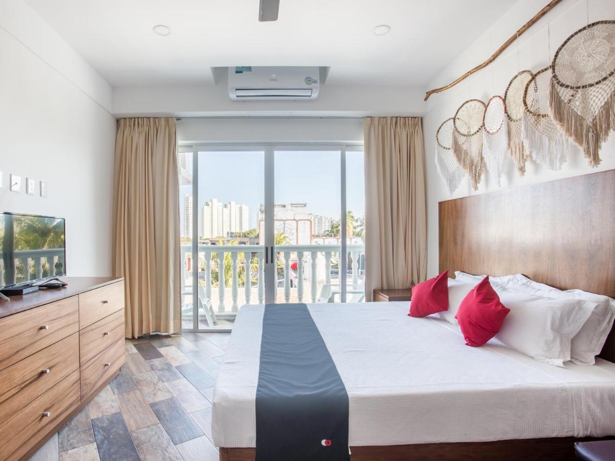 Capital O Cancun Ocean View, Cancún Buitenkant foto A bedroom at the hotel