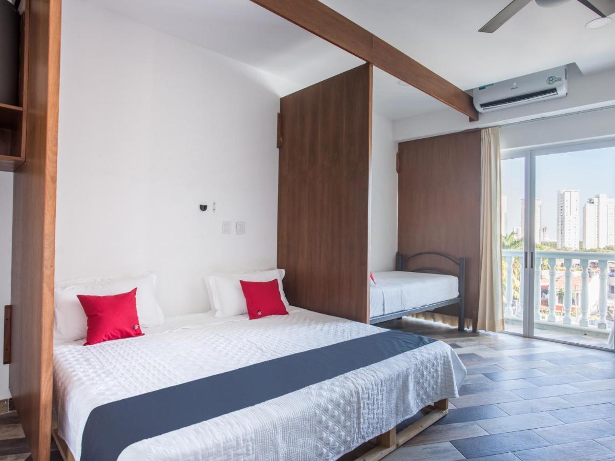 Capital O Cancun Ocean View, Cancún Buitenkant foto A bedroom at the hotel